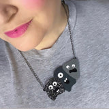three rock monster acrylic necklace