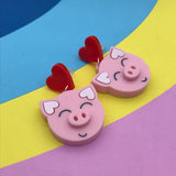 laser cut acrylic pig and heart earrings