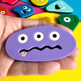 tongue out rock monster brooch