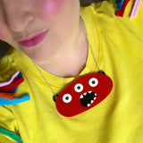 red monster laser cut necklace