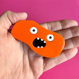 acrylic orange rock monster brooch