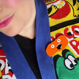 orange monster brooch
